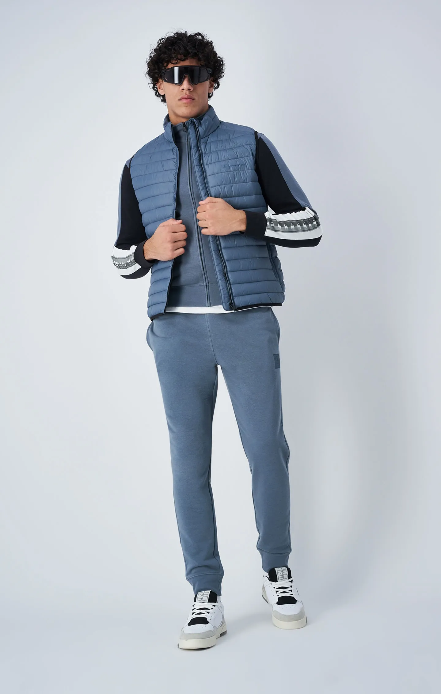 Champion France logo sleeveless puffer jacket.
